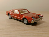 276 Oldsmobile Toronado in metallic red