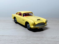 218 Aston Martin in yellow with cast wheels