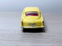 218 Aston Martin in yellow with cast wheels