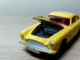218 Aston Martin in yellow with cast wheels