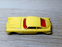 218 Aston Martin in yellow with cast wheels