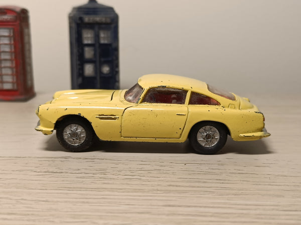 218 Aston Martin in yellow with cast wheels