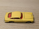 218 Aston Martin in yellow with cast wheels