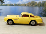 218 Aston Martin in yellow with cast wheels