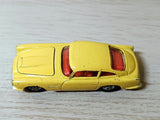 218 Aston Martin in yellow with cast wheels