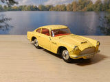218 Aston Martin DB4 yellow with free spinning wheels