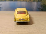 218 Aston Martin DB4 yellow with free spinning wheels