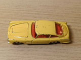 218 Aston Martin DB4 yellow with free spinning wheels