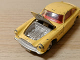 218 Aston Martin DB4 yellow with free spinning wheels