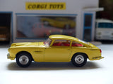 218 Aston Martin in yellow with fixed wheels and open vent