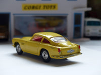 218 Aston Martin in yellow with fixed wheels and open vent