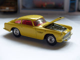 218 Aston Martin in yellow with fixed wheels and open vent