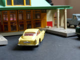 218 Aston Martin DB4 yellow with free spinning wheels