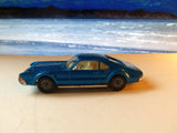 264 Oldsmobile Toronado in bright blue-turquoise with tow bar