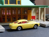 218 Aston Martin DB4 yellow with cast wheels