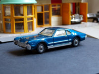 264 Oldsmobile Toronado in deep blue with tow bar