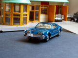 264 Oldsmobile Toronado in deep blue with tow bar