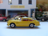 218 Aston Martin DB4 yellow *rare with fixed shaped wheels*