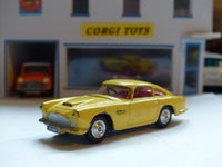 218 Aston Martin DB4 yellow *rare with fixed shaped wheels*(1)