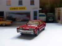 276 Oldsmobile Toronado in metallic red