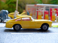 218 Aston Martin in yellow with cast wheels