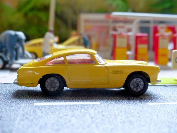 218 Aston Martin in yellow with cast wheels