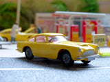 218 Aston Martin in yellow with cast wheels