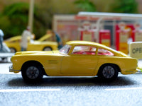 218 Aston Martin in yellow with cast wheels