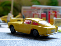218 Aston Martin in yellow with cast wheels