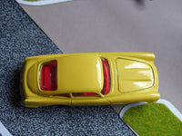 218 Aston Martin in yellow with cast wheels