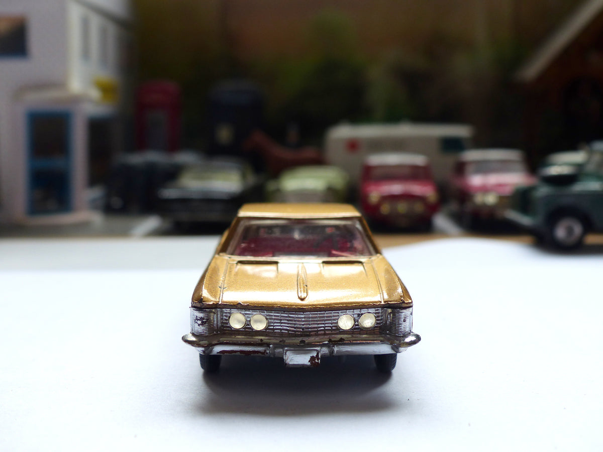 245 Buick Riviera in gold *with cast wheels* (2) – Corgi Toys